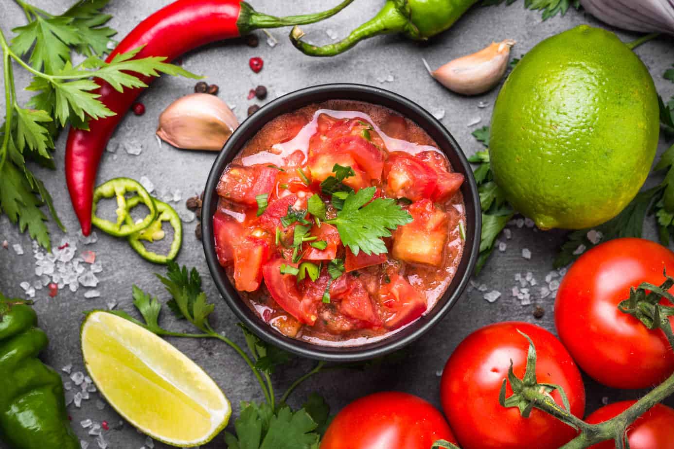closeup of a healthy salsa recipe with ingredients on a table